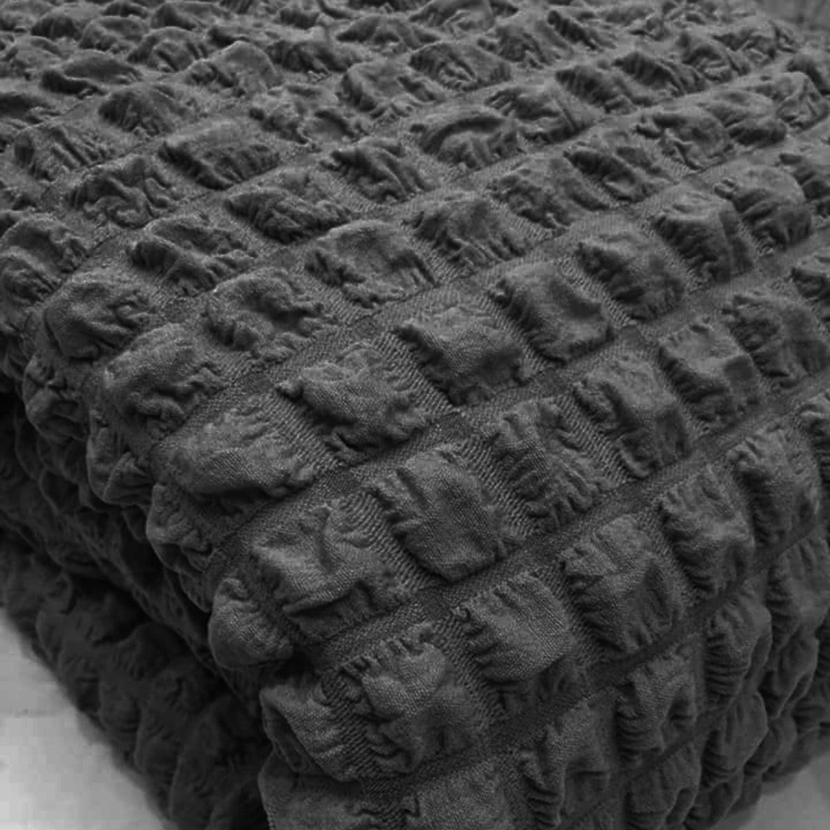 Copridivano elasticizzato con tessuto bolle grigio scuro