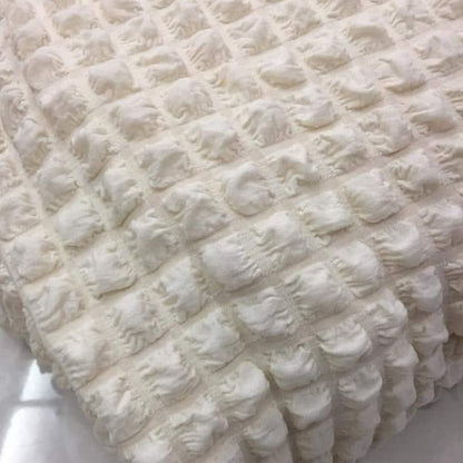 Copridivano elasticizzato con tessuto bolle panna