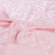 Tessuto raso ghirigori rosa